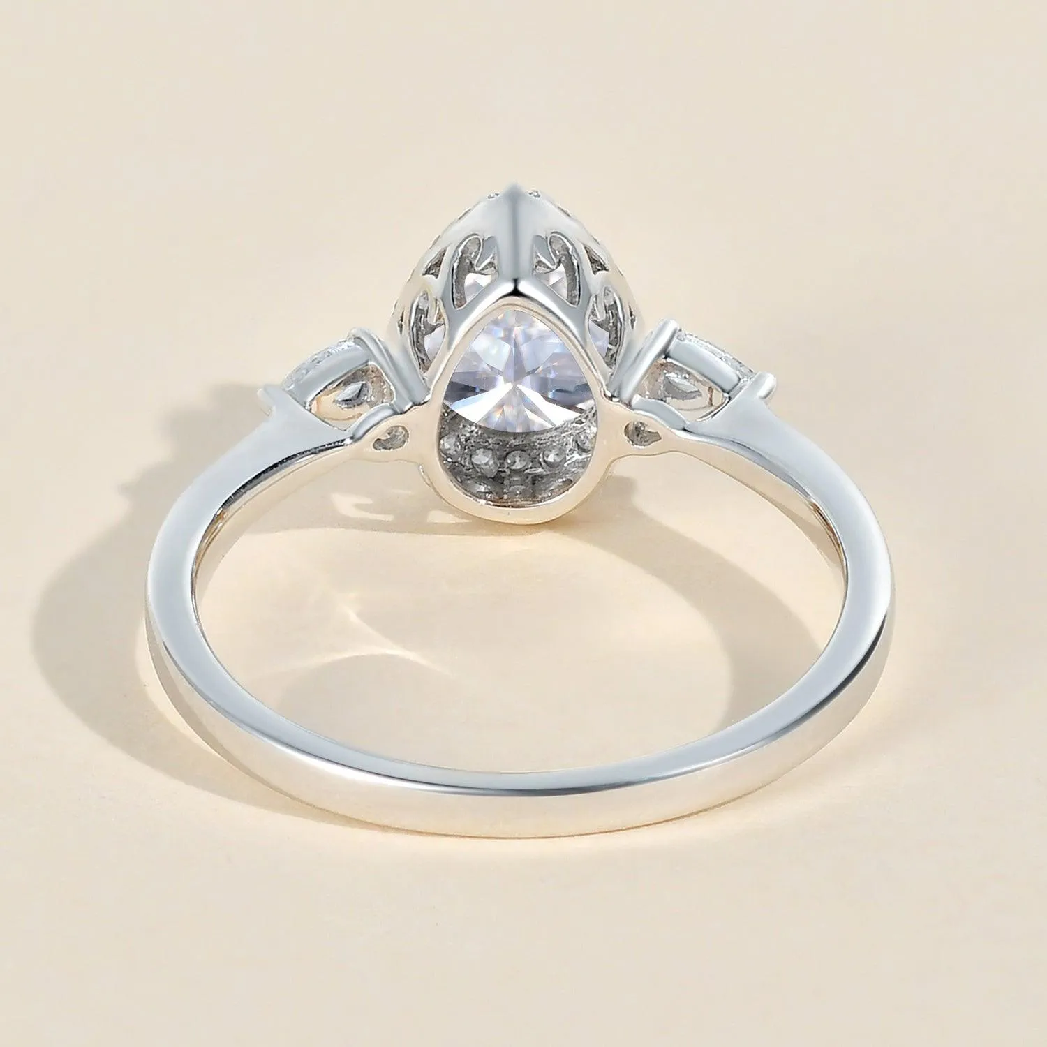 1.0ct Pear Shaped Moissanite Three-Stone Halo Ring